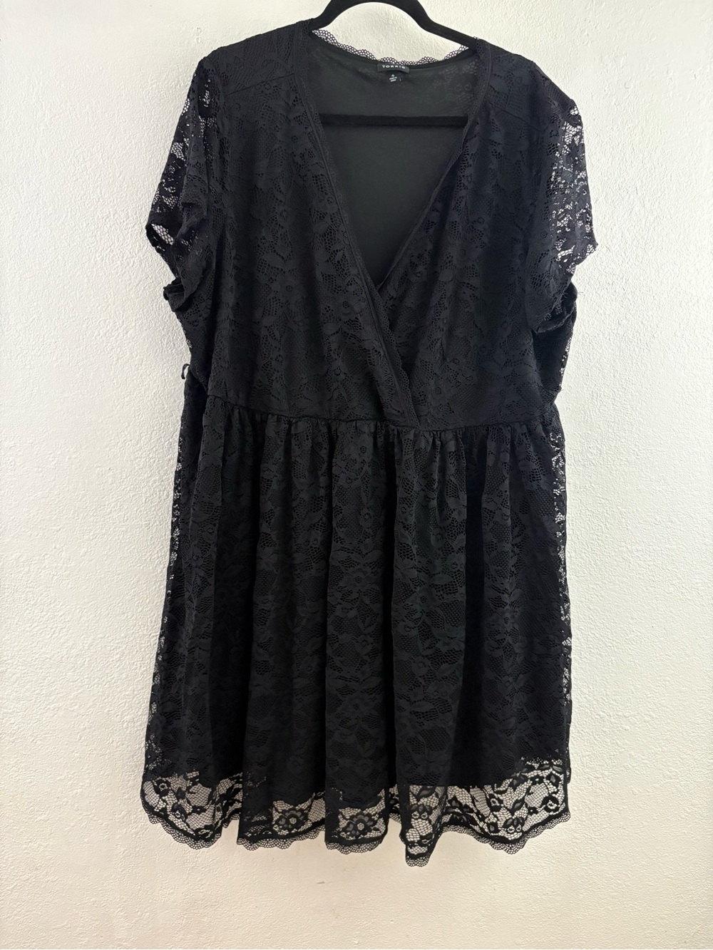 Torrid mini blac lace wrap dress featuring a v-neckline and short sleeves 4X